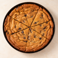 Whole Deep Dish Chocolate Chunk Cookie in its round baking pan